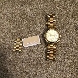Michael Kors gold watch, lightly used with tags